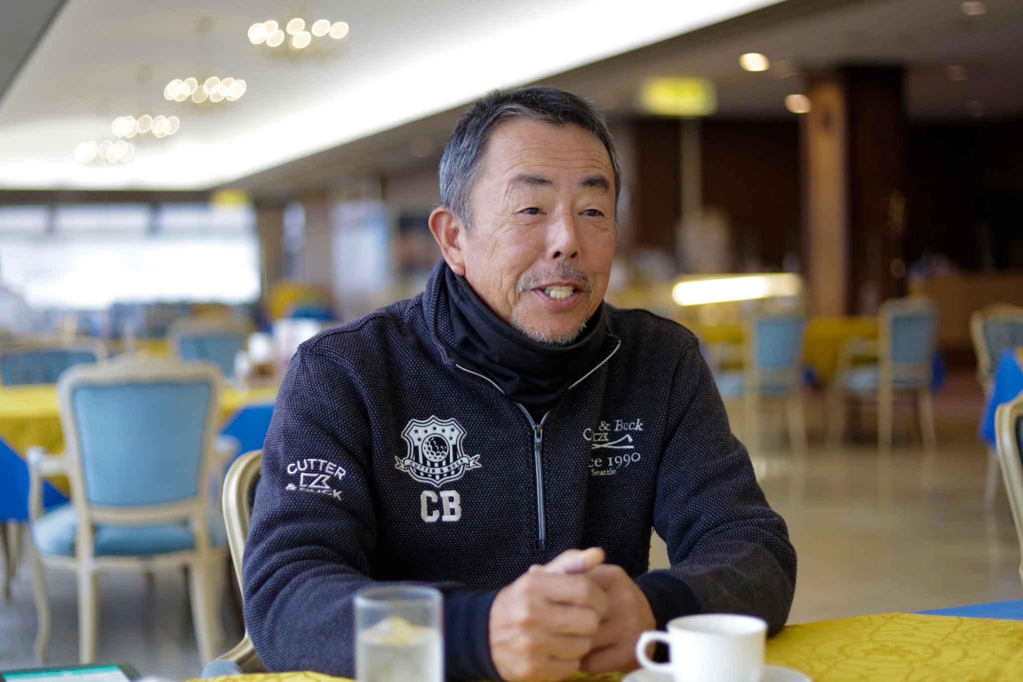 インタビューに答える関西ゴルフサークル セブンエイトの大西均さん