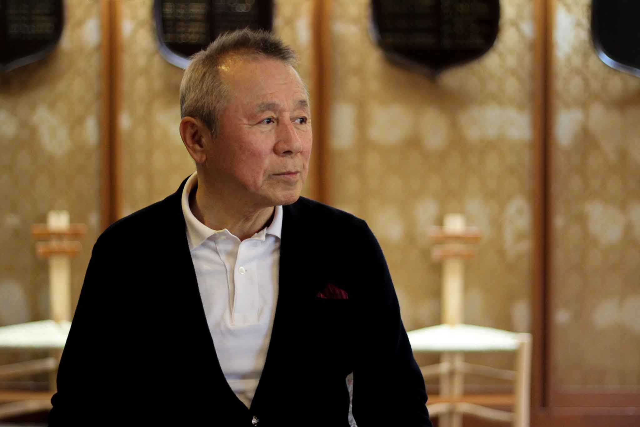 倶楽部ハウスでインタビューに答える田中さん